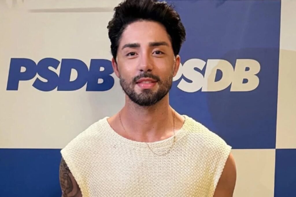 Quem é Rico Melquiades e por que ele é famoso? Rico Melquiades é um influenciador digital e foi o campeão da 13ª edição do reality show "A Fazenda". Ele é conhecido por seu carisma e personalidade marcante, o que lhe rendeu uma grande base de fãs nas redes sociais. Por que Rico Melquiades decidiu se filiar ao PSDB? Rico Melquiades anunciou sua filiação ao PSDB através do Instagram. Ele pretende se candidatar a deputado federal por Alagoas, buscando expandir sua influência para a política. Qual foi a reação dos seguidores de Rico Melquiades à sua filiação política? A reação dos seguidores de Rico foi mista, mas predominantemente de surpresa e apoio. Com 11,6 milhões de seguidores, suas decisões têm grande impacto e geram discussões. Quais são os planos de Rico Melquiades para sua carreira política? Rico Melquiades planeja se candidatar a deputado federal nas próximas eleições. Ele expressou confiança em sua eleição, afirmando que está pronto para chegar a Brasília. Como o PSDB reagiu à filiação de Rico Melquiades? O PSDB republicou o anúncio de Rico em seu perfil oficial no Instagram, indicando apoio e reconhecimento da influência do influenciador na política. Qual é a promessa ousada que Rico Melquiades fez ao anunciar sua candidatura? Rico Melquiades não especificou a promessa em detalhes, mas sua confiança em ser eleito e seu entusiasmo sugerem que ele tem planos ambiciosos para sua atuação política. Como a experiência em "A Fazenda" pode influenciar a carreira política de Rico Melquiades? A experiência em "A Fazenda" deu a Rico visibilidade e habilidades de comunicação que podem ser valiosas na política, ajudando-o a se conectar com o público. Quais são os desafios que Rico Melquiades pode enfrentar na política? Rico pode enfrentar desafios como a adaptação ao ambiente político, a necessidade de criar propostas concretas e a superação de preconceitos por ser um influenciador. Como a remodelação corporal de Rico Melquiades se relaciona com sua imagem pública? Após mais de 10 cirurgias, Rico passou por nova remodelação corporal, o que pode influenciar sua imagem pública, mostrando dedicação à sua aparência e saúde. Qual é o impacto das redes sociais na carreira de Rico Melquiades? Com 11,6 milhões de seguidores, as redes sociais são cruciais para Rico, permitindo-lhe comunicar-se diretamente com seu público e influenciar opiniões. Como a popularidade de Rico Melquiades pode afetar sua campanha política? Sua popularidade pode ser uma vantagem, atraindo eleitores jovens e conectados, mas ele precisará converter seguidores em votos efetivos. O que a candidatura de Rico Melquiades representa para influenciadores digitais? Sua candidatura pode abrir portas para outros influenciadores na política, mostrando que a presença digital pode ser uma plataforma poderosa para mudanças sociais. Quais são as expectativas dos eleitores em relação a Rico Melquiades como político? Os eleitores esperam que Rico traga inovação e autenticidade à política, aproveitando sua experiência como influenciador para representar novas vozes. Como Rico Melquiades pode usar sua influência para promover mudanças políticas? Rico pode usar sua plataforma para destacar questões importantes, mobilizar jovens eleitores e promover debates sobre temas relevantes para a sociedade.